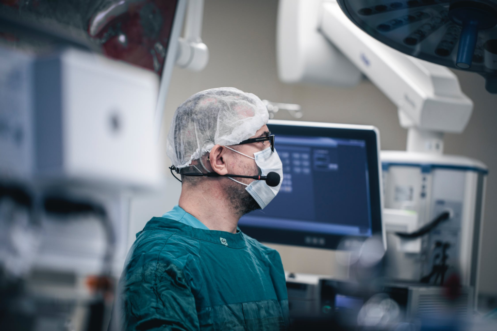 hernia surgeon looking at machine screen